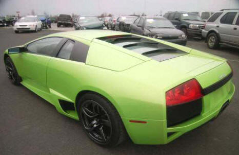 Metallic Green AWD Murcielago Lamborghini with Gray Leather Recaro Seats and Alloy Wheels with Michelin Tires